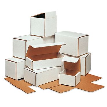 Various white cardboard boxes, some open and some closed, arranged on a flat surface.