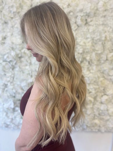 Balayage blonde hair with Kovi genius weft extensions and soft natural movement