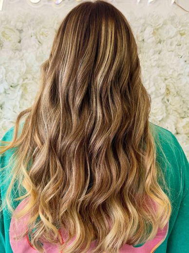 Back view of a dimensional full balayage and haircut in Fort Lauderdale