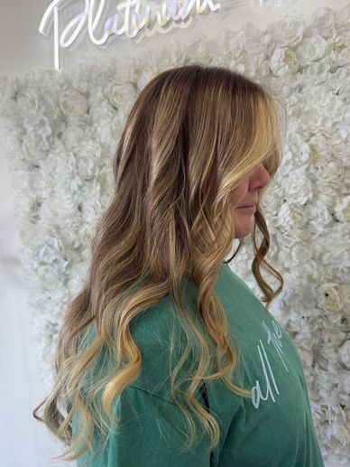 Profile view of a full balayage and layered haircut in Fort Lauderdale