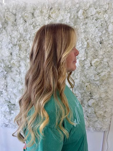 Full balayage with soft blonde highlights and haircut in Fort Lauderdale