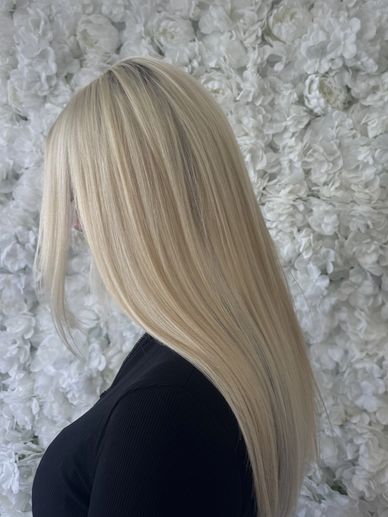 Bright platinum blonde hair with K-tip extensions