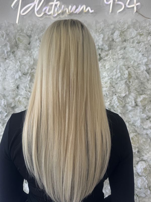 Platinum blonde hair transformation by Vita Lambillotte at Platinum 954 Hair Salon Fort Lauderdale