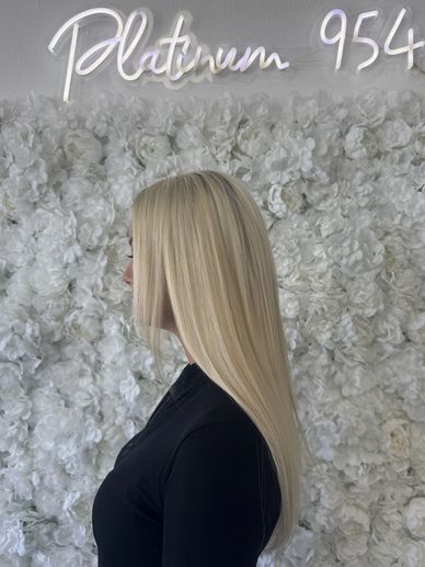 Platinum blonde hair with K-tip hair extensions side view