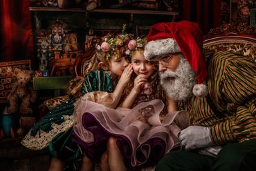 Painterly portrait 2 little girls in fancy dresses and flowered crowns whispering secrets with Santa
