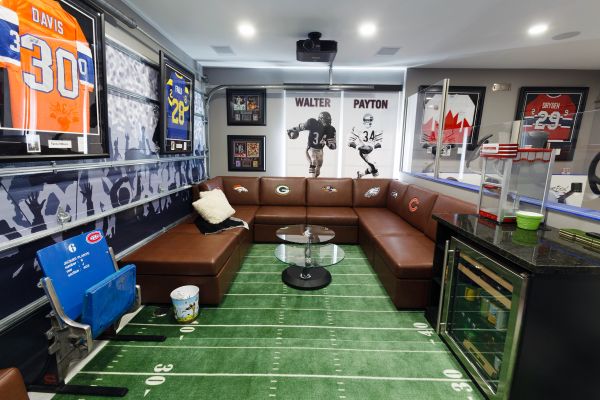 Sports-themed room with football and hockey memorabilia.