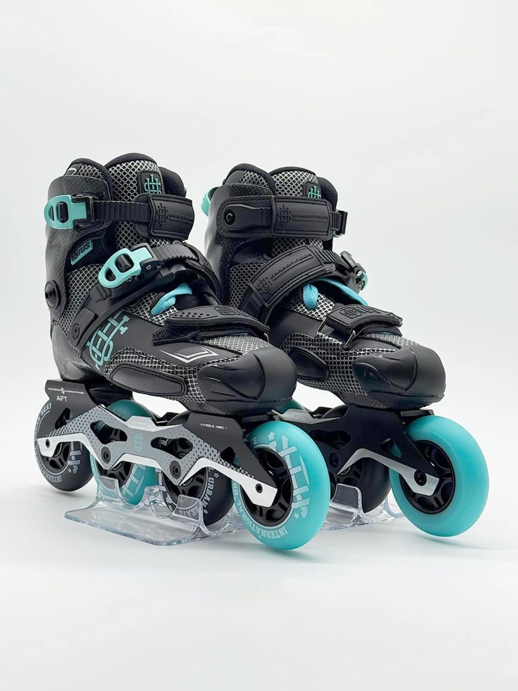 Black and teal inline skates with a sturdy design and four wheels each.
