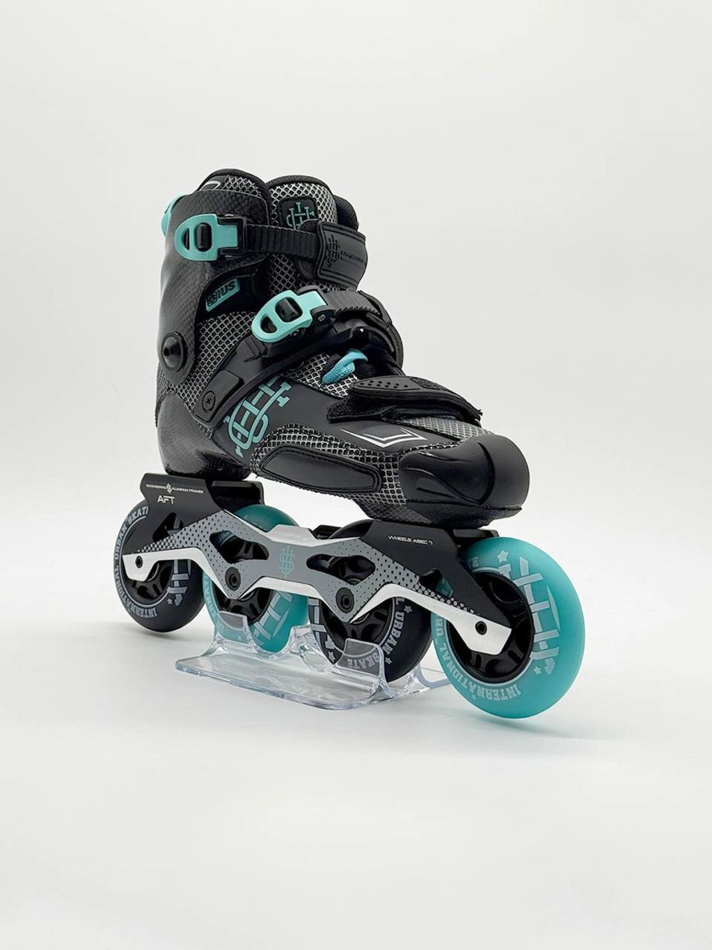 Black and turquoise inline skate with three wheels on a clear stand.