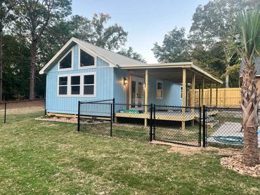 Tiny home with a covered porch, wired during construction