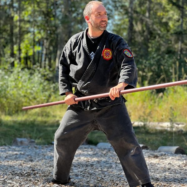 Sensei, bo-jutsu martial arts training outdoors