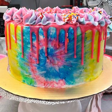 Rainbow drip cake with sprinkles