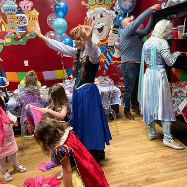 Children meeting costumed party characters