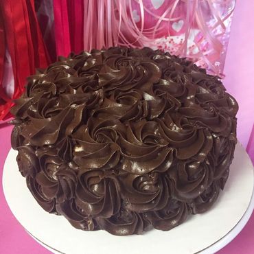 Chocolate rosette frosted cake