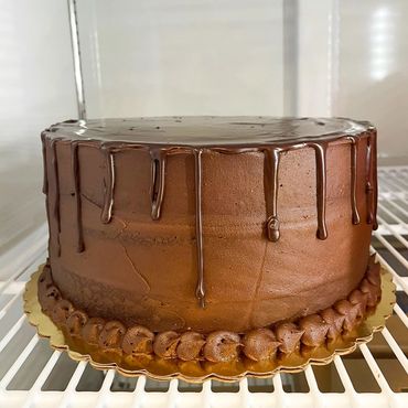 Chocolate drip cake on stand
