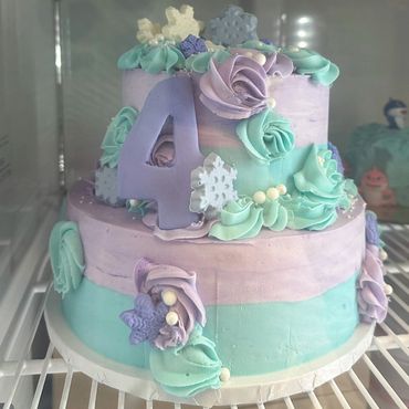 Tiered cake with pastel flowers