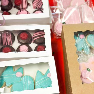 Boxed chocolates and iced cookies