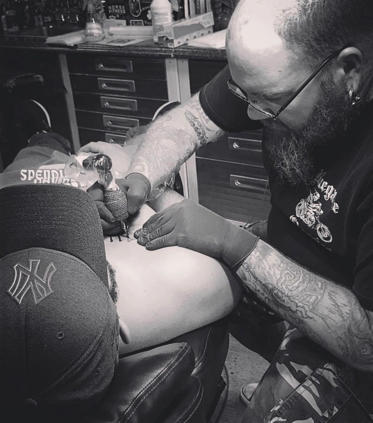 tiki steve tattooing chest black and grey
