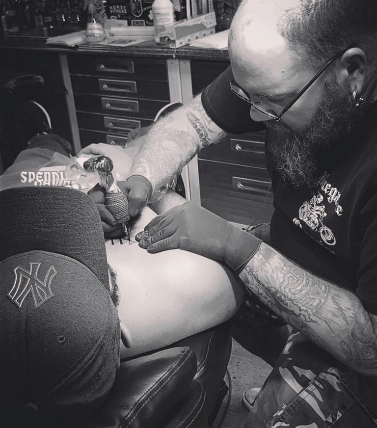 tiki steve tattooing chest black and grey