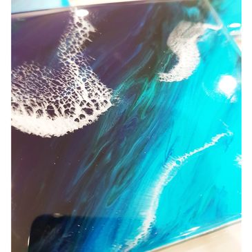 set of 4 coasters. ocean colours. hues of blue with crashing white waves.