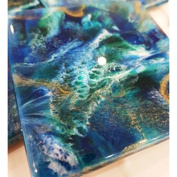 Coaster set of 4. In rich blue greens with gold sparkle.