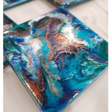Coaster set of 4. in beautiful rich blue greens and copper.
