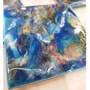 beautiful blue gold white coaster set with  subtle hints of  pink.