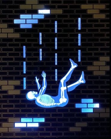 Falling man in a LED light box.