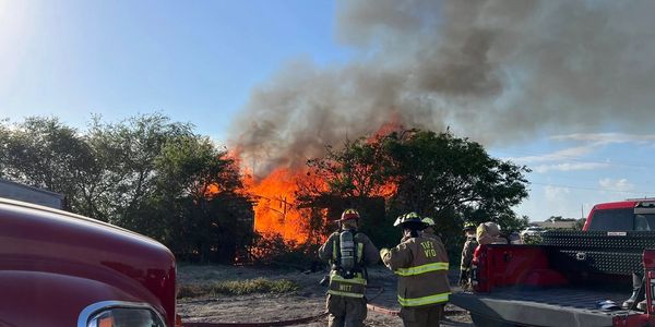 Volunteer firefighters conduct live burn training in Sinton during a controlled structure fire.