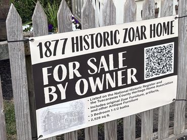 Vinyl banner advertising a home for sale with QR code.