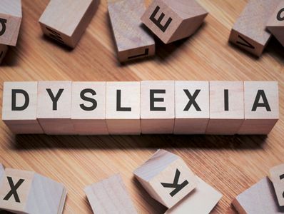 Wooden letter blocks that spells Dyslexia