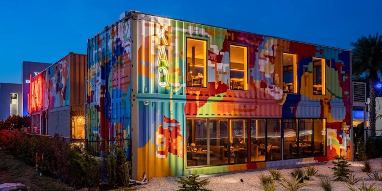 KAO Bar and Sushi is a shipping container turned boutique restaurant. A vibrant mural covers the shi
