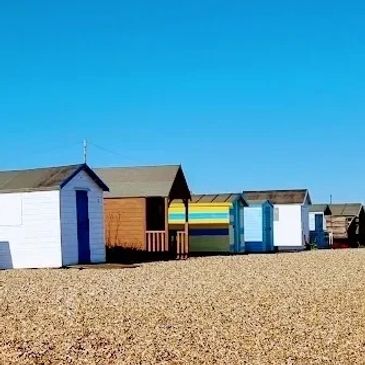 Beach huts on Kingsdown beach by the Zetland Arms