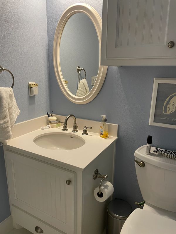 Full-sized bath with shower/tub combo. Accessed and shared by bedrooms.