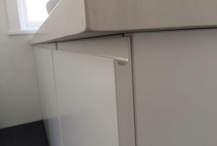 Routered handle White slab closet StoneWood Joinery Victoria BC