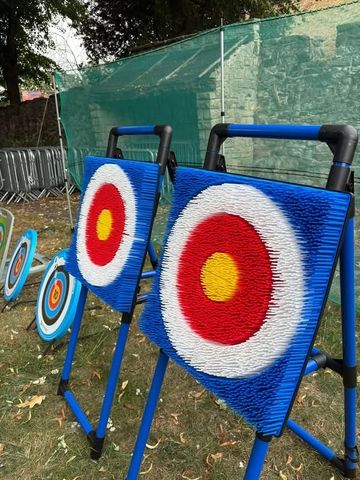 Archery targets lined up outdoors for practice or competition.