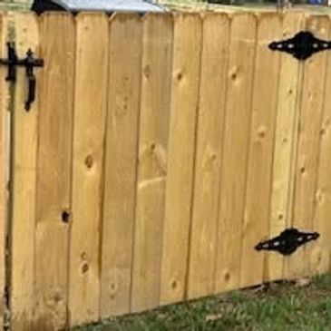 wood gate built into an existing fnce line by Ronald Willis of Willis Outdoors LLC.