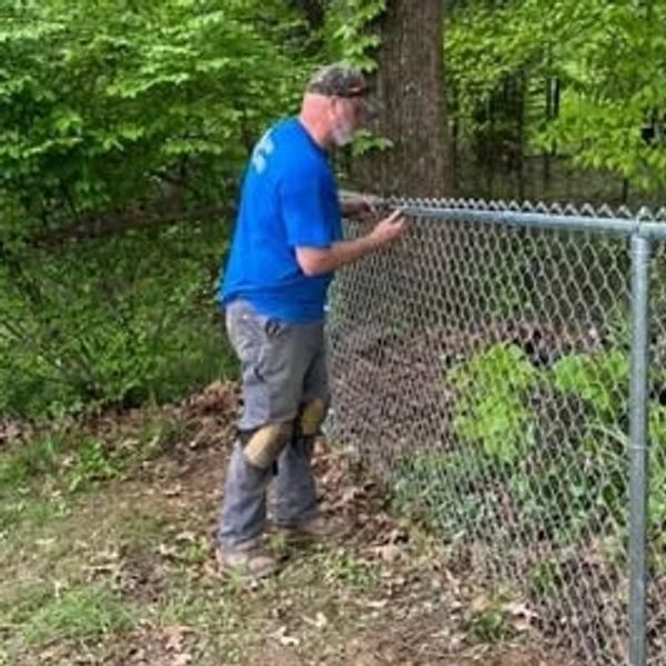 Fence Professionald Ronald Willis replacing a chain-link fence in Newburgh, Indiana