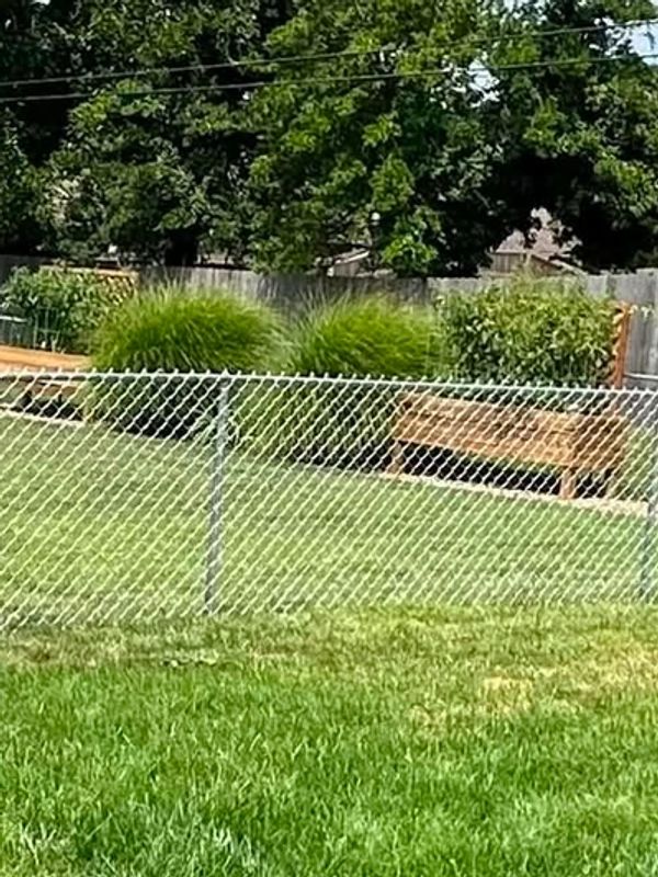 Chain link 4' tall residential fence addition in Newburgh, Indiana installed by Willis Outdoors LLC