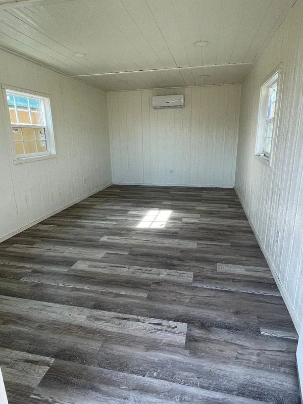 Interior finished in LP Smarside in White, weathered wood vinyl, mini split and wafer lights.