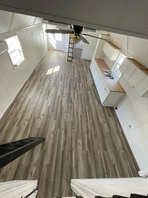 White paint helps bring in natural light making this tiny home feel much more spacious.