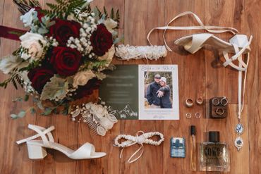 Wedding accessories including shoes, rings, bouquet, and save-the-date card.