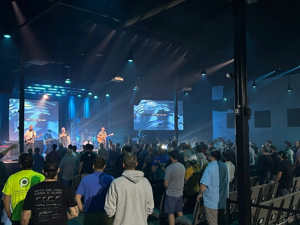 men worshiping Jesus