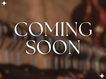 Text saying 'COMING SOON' with a blurred background.