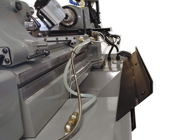 Rear Chip Guard removed for cleaning on a Babin TML-5Cst. Bracket attached shown.