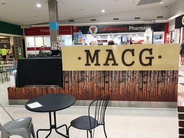 Shop Front revamp - Digital printed wood panel with Stained Cnc Cut letters over top.