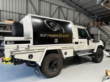 Custom Surveyors @ Work vehicles signage.
Chrome on black.