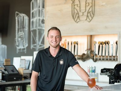 Cody Griffith, Taproom Manager (headshot of him at the bar)