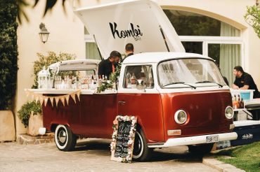 Vintage red van converted into a stylish outdoor bar.