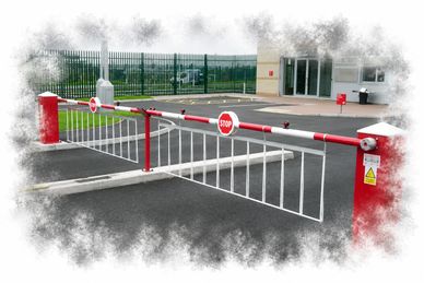 Red and white automatic stop barriers blocking a driveway.