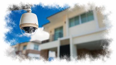 Security camera monitoring a residential area under clear skies.